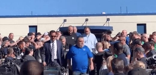 Philadelphia police officer Joe Bologna receives standing ovation from fellow officers.